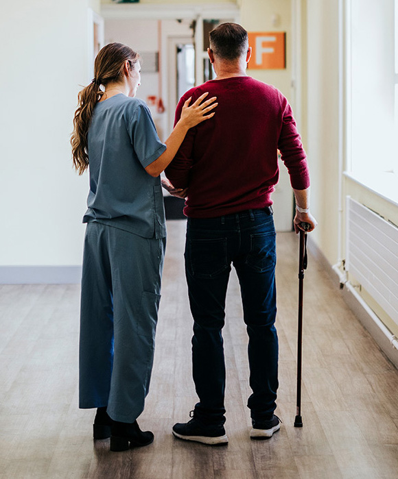 Physiatrist training a patient to walk again